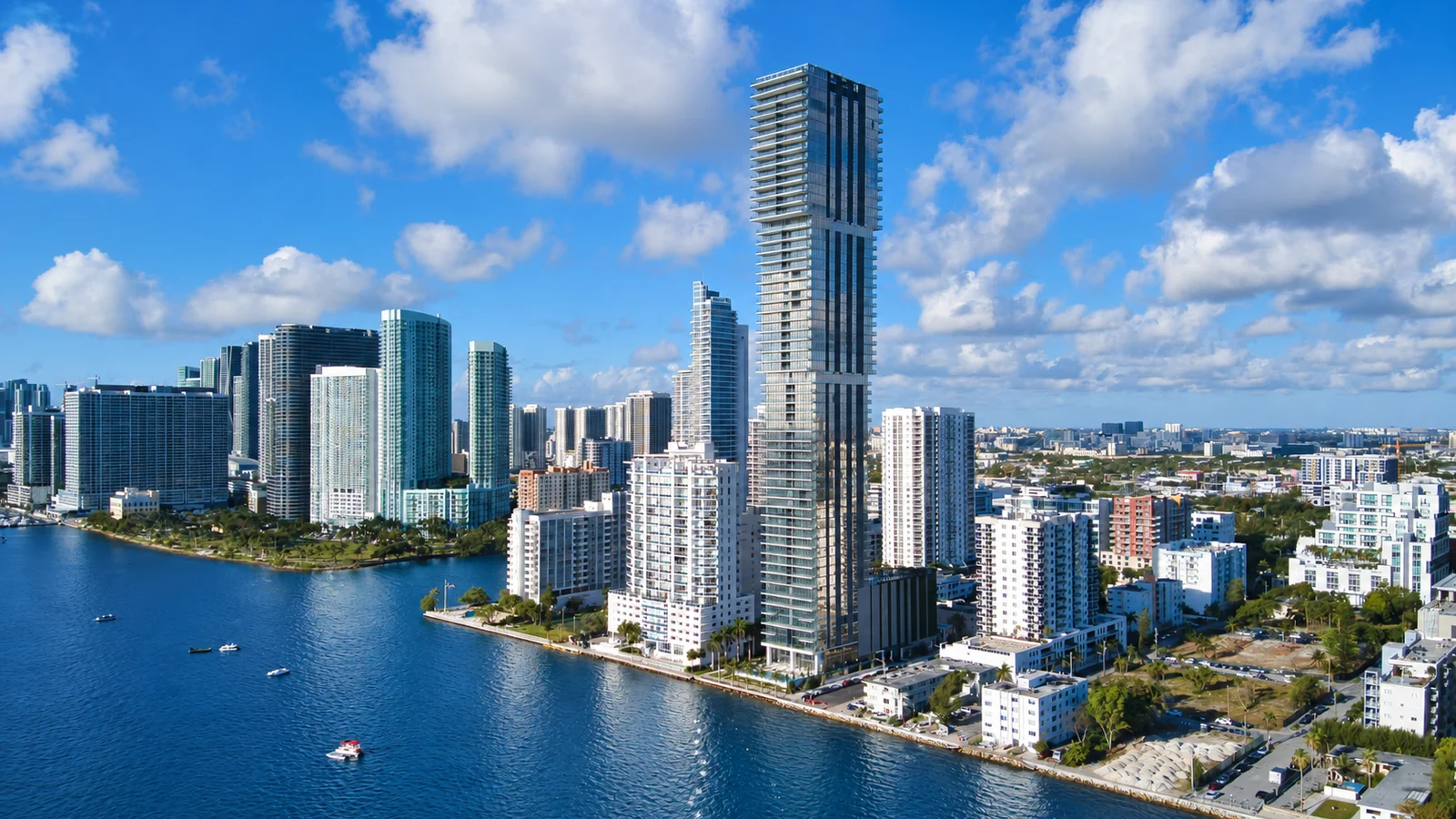 Edgewater's Biscayne Bay waterfront with the Elysee Miami tower, neighboring buildings and boats